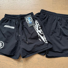 Hellstar shorts Casual style with a washed, distressed, and splatter-paint finish