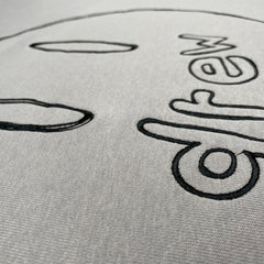 DREW HOUSE Long-sleeved Sketch of a big laughing face