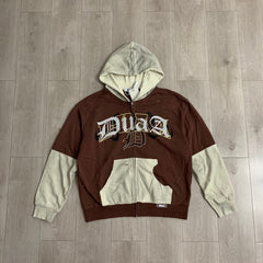 DUAA Hoodie Trendy patchwork French terry sweatshirt featuring distressed details and rhinestone embellishments.