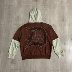 DUAA Hoodie Trendy patchwork French terry sweatshirt featuring distressed details and rhinestone embellishments.