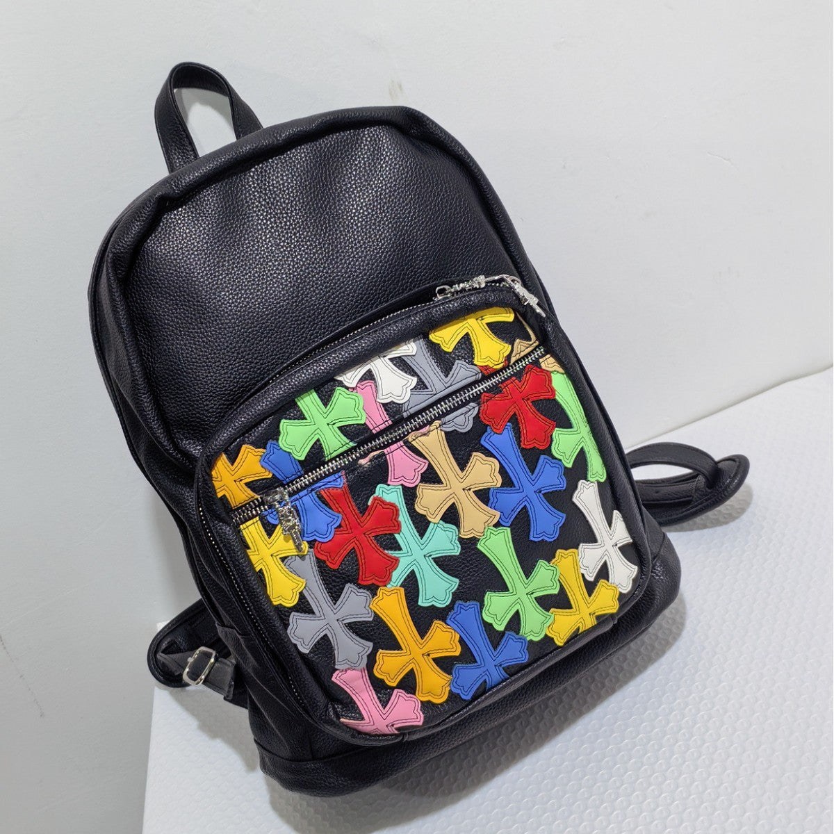 Cross-pattern bag Chrome colored leather splicing backpack schoolbag retro large capacity men and women