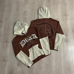 DUAA Hoodie Trendy patchwork French terry sweatshirt featuring distressed details and rhinestone embellishments.